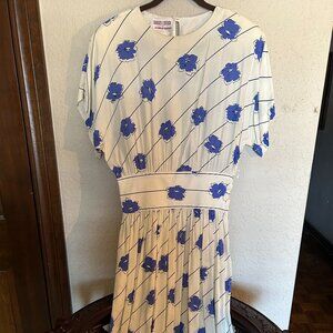 Maggy London Elegant Dress White background  with blue flowers